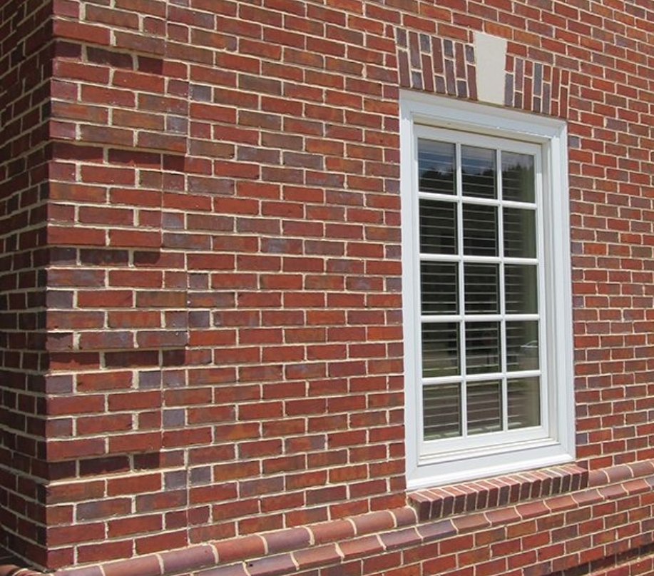 Red brick corner detail with window - precision craftsmanship