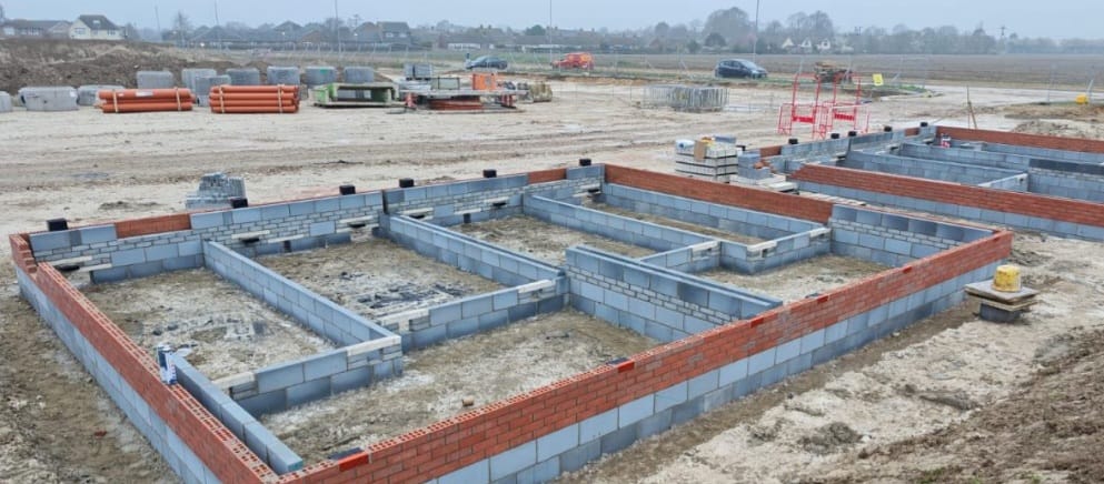 Wide view of housing development - brick and block foundations