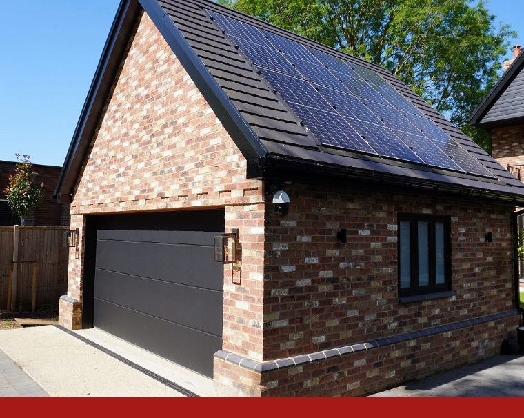 Completed brick garage with solar panels - new build