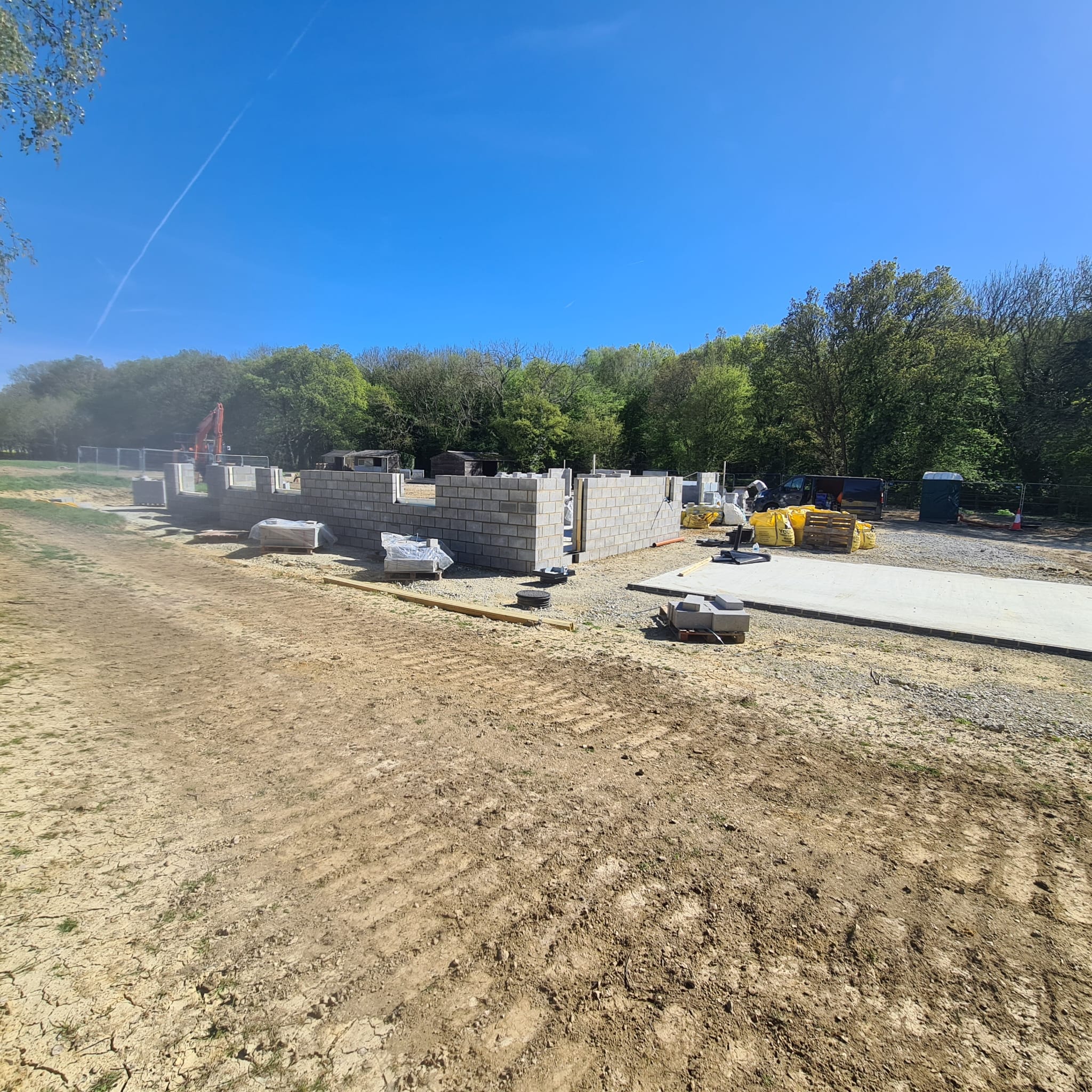 Wide view of new build site with multiple structures