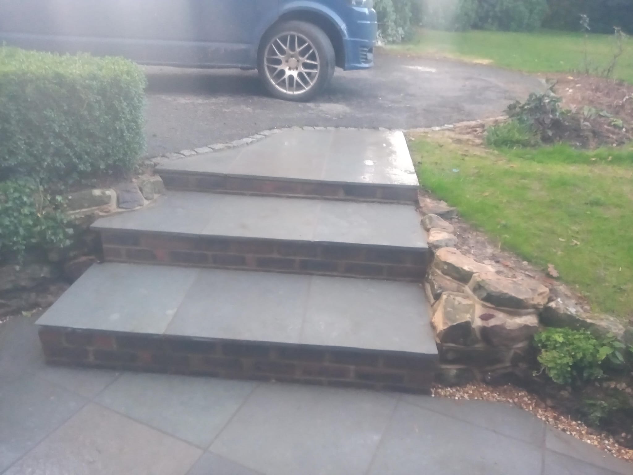 Stone steps with brick risers and natural stone edging