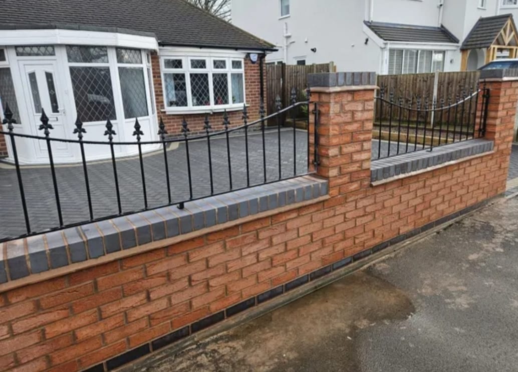 Brick boundary wall with railings by L.J.O' Brickwork